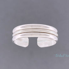 Load image into Gallery viewer, toe ring with three bands of silver floating over a grey background.