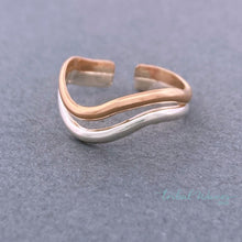 Load image into Gallery viewer, Double Band Wave Mixed Metal Adjustable Toe Ring sitting on a dark grey background.